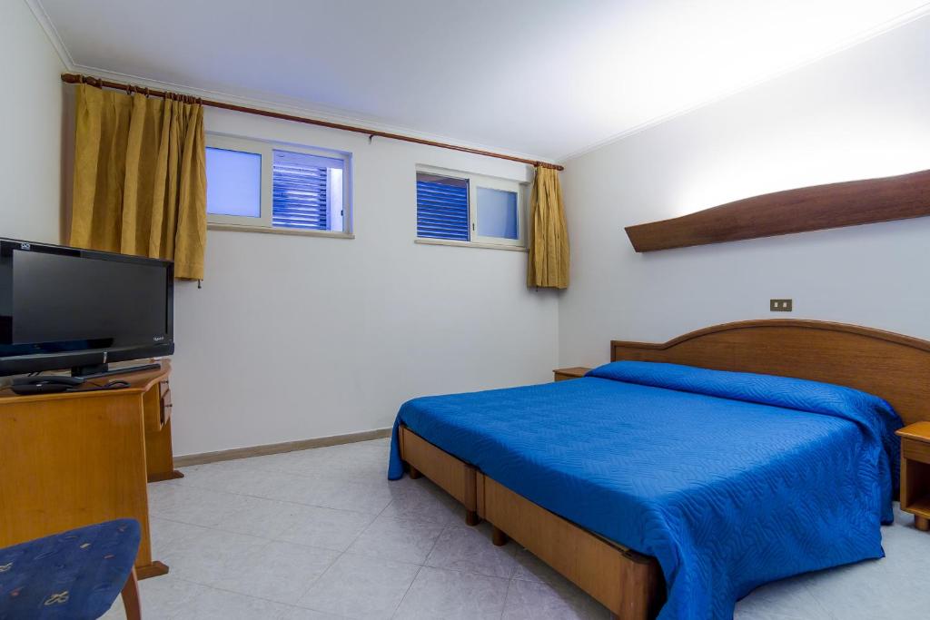 Postel nebo postele na pokoji v ubytování HR Hotel & Spa