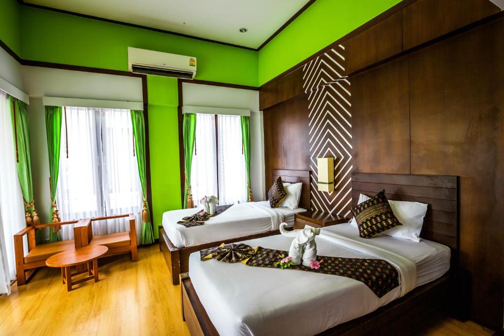 Letto o letti in una camera di Phi Phi Andaman Beach Resort