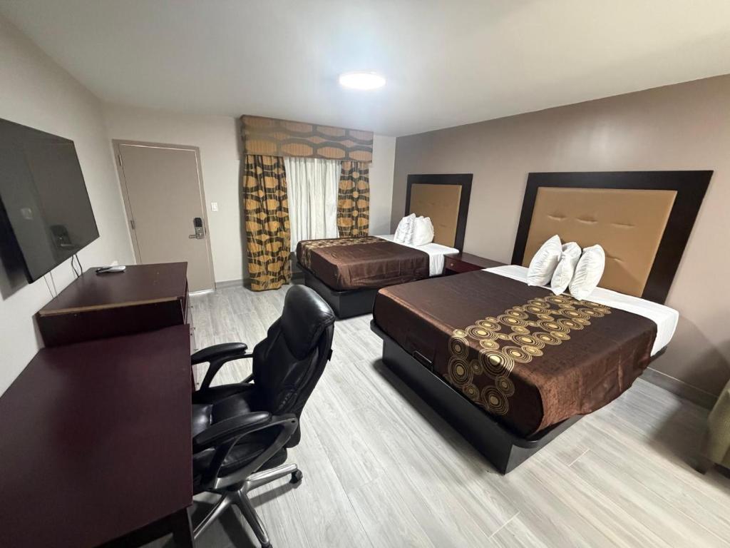 En eller flere senge i et værelse på Ivory Tower Motor Inn Green Brook