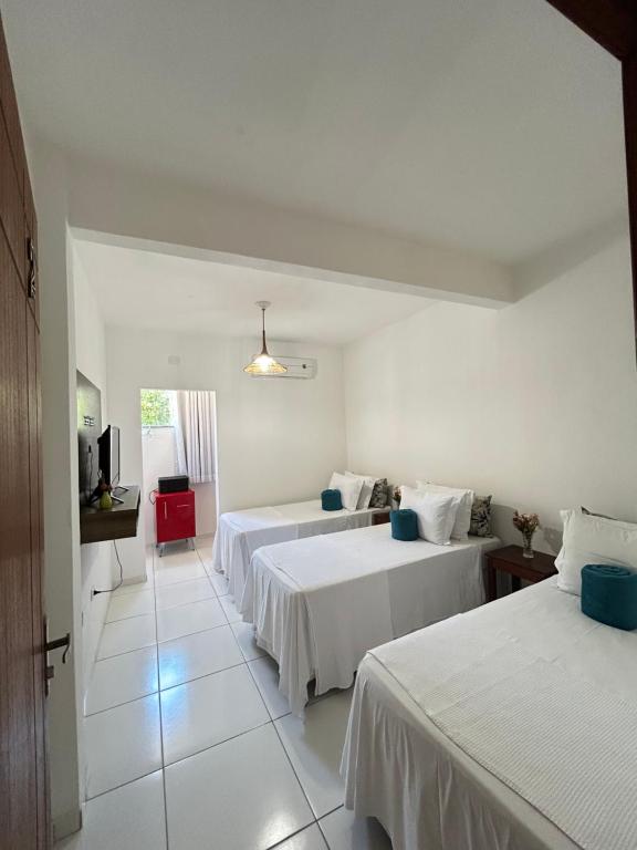 Giường trong phòng chung tại Pousada Sol & Mar