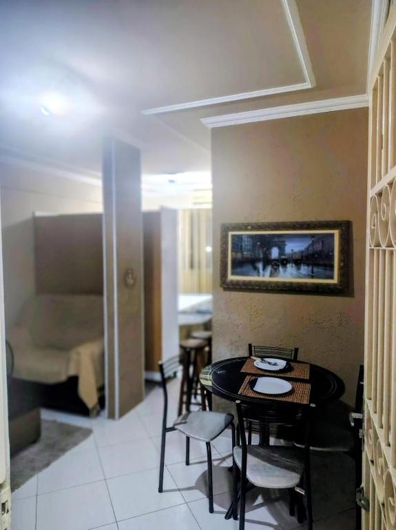 Et opholdsområde på Flat confortável