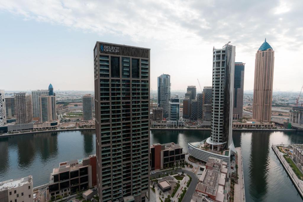 a view of a city with a river and buildings at Heaven's Dreams Business Bay in Dubai