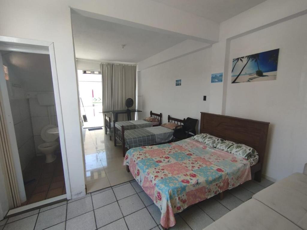 En eller flere senge i et værelse på Suite Penha Beto Carrero World