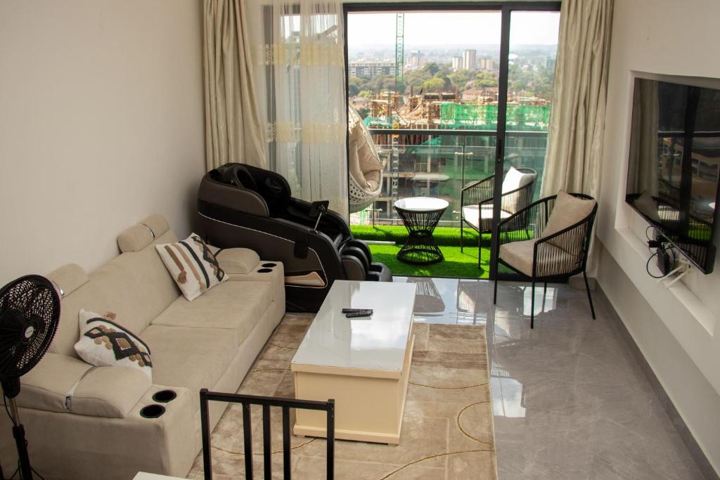 a living room with a couch and chairs at Skyline Luxury 17th-Floor 1BR near Junction Mall - City Views, Pool, Gym & Full-Body Massage Chair in Nairobi