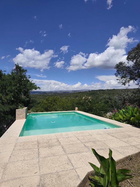 a swimming pool with a view of the ocean at Casa en Cabalango in Cavalango