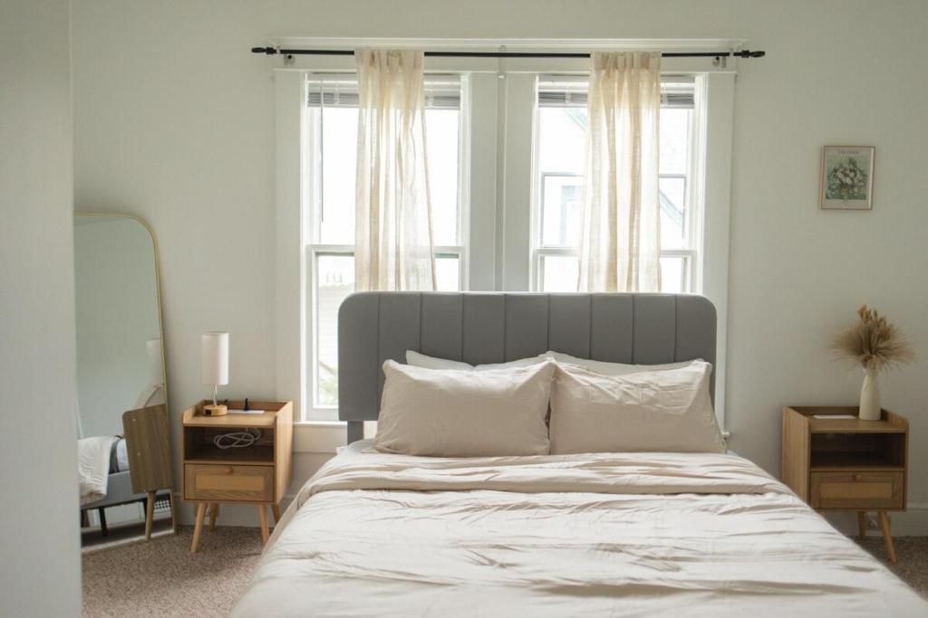 a bedroom with a bed with a large window at Charming Spacious 3BR Pet-Friendly Retreat in Billings