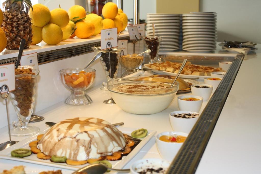 a buffet with different types of food on a table at Hydrele Beach Hotel & Village in Potokáki