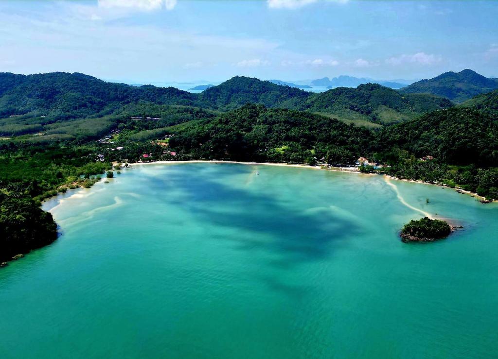 an island in the middle of a large body of water at Tha Khao Beach House - Koh Yao Noi, no swimming pool in Ko Yao Noi