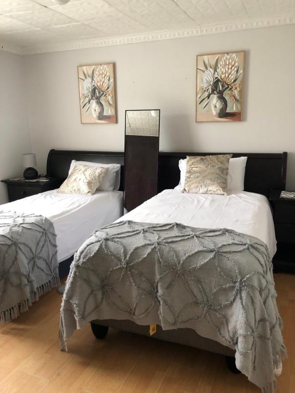 En eller flere senge i et værelse på Bonnie Guest house