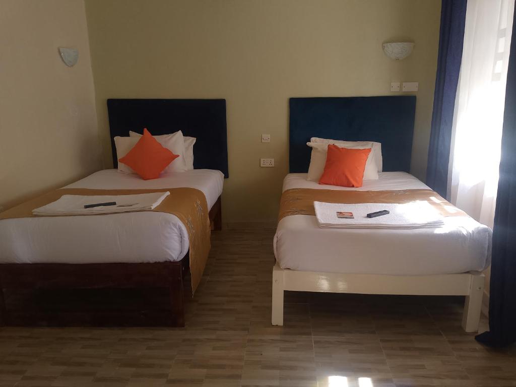 Een bed of bedden in een kamer bij Wonderful Guesthouse