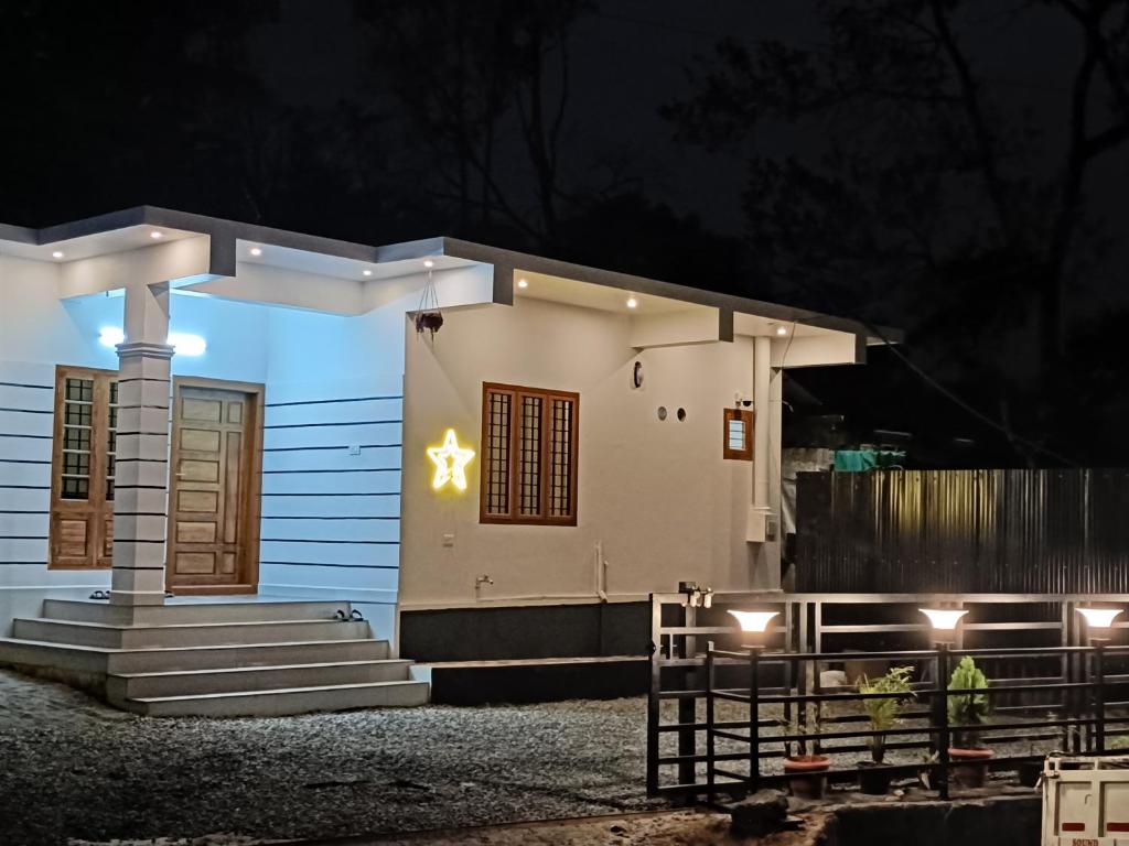 a small house with a star on the side of it at Eva homes in Vagamon