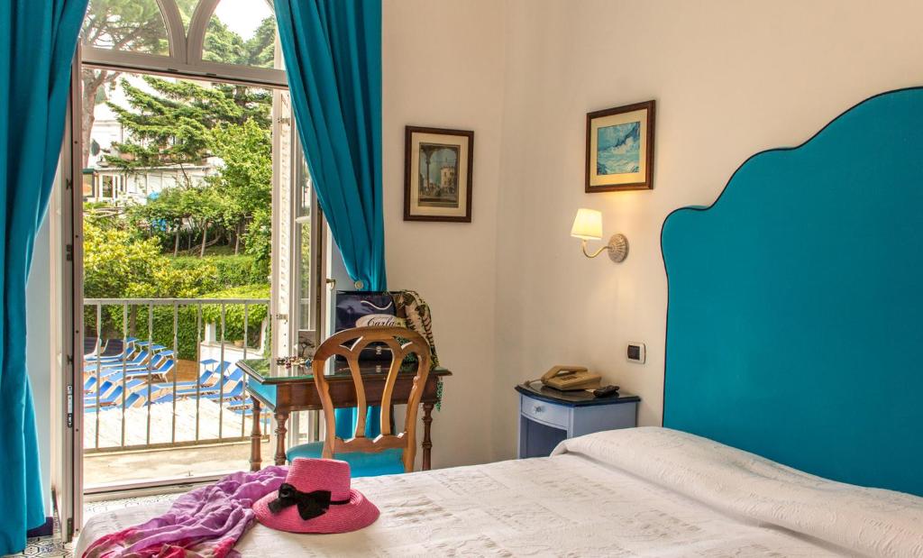 Postel nebo postele na pokoji v ubytování Hotel Giordano