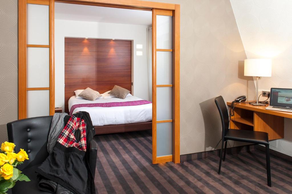 Un ou plusieurs lits dans un hébergement de l'établissement Brit Hotel Belfort Centre-Le Boreal
