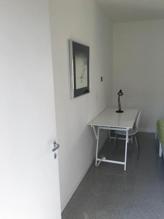 a desk in a room with a table and a chair at Casa Maria in Salerno