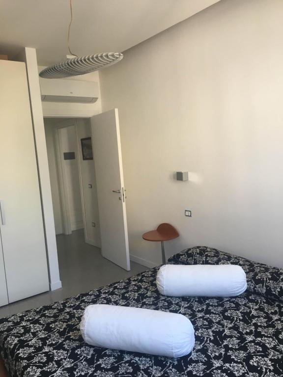 a room with a bed with two pillows on it at Casa Maria in Salerno