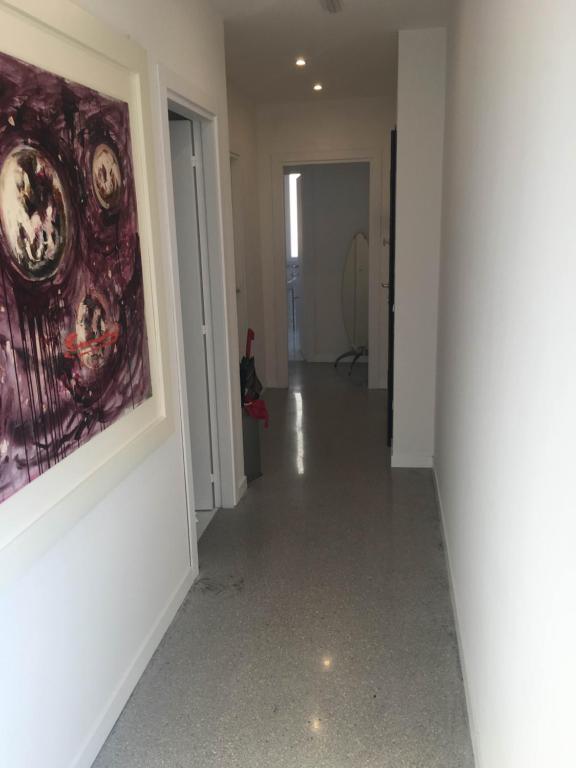 an empty hallway with a painting on the wall at Casa Maria in Salerno