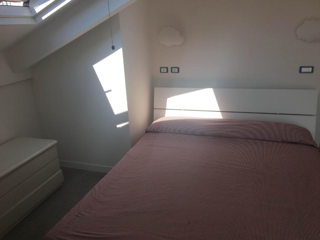 a bedroom with a bed and a window at Casa Maria in Salerno