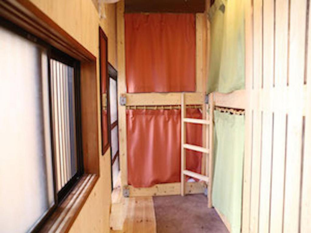 Postel nebo postele na pokoji v ubytování Kagaribi Guesthouse
