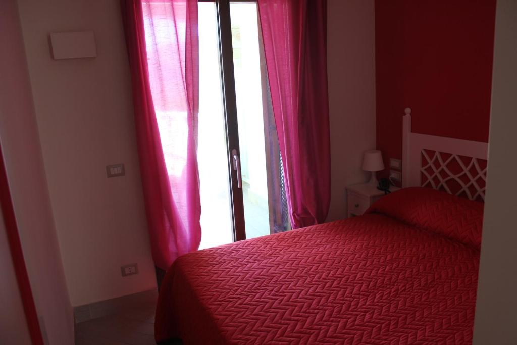 Postel nebo postele na pokoji v ubytování Holiday Lodge al Porto