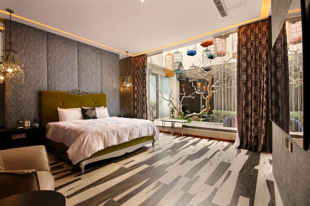 Postel nebo postele na pokoji v ubytování Mulan Motel