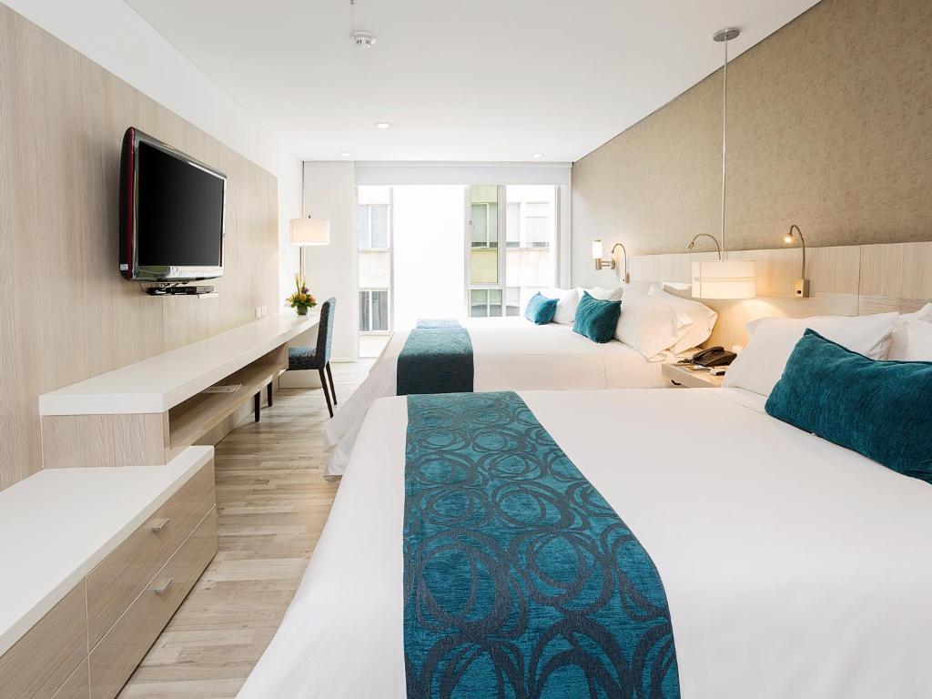 Postel nebo postele na pokoji v ubytování Hotel bh Bicentenario