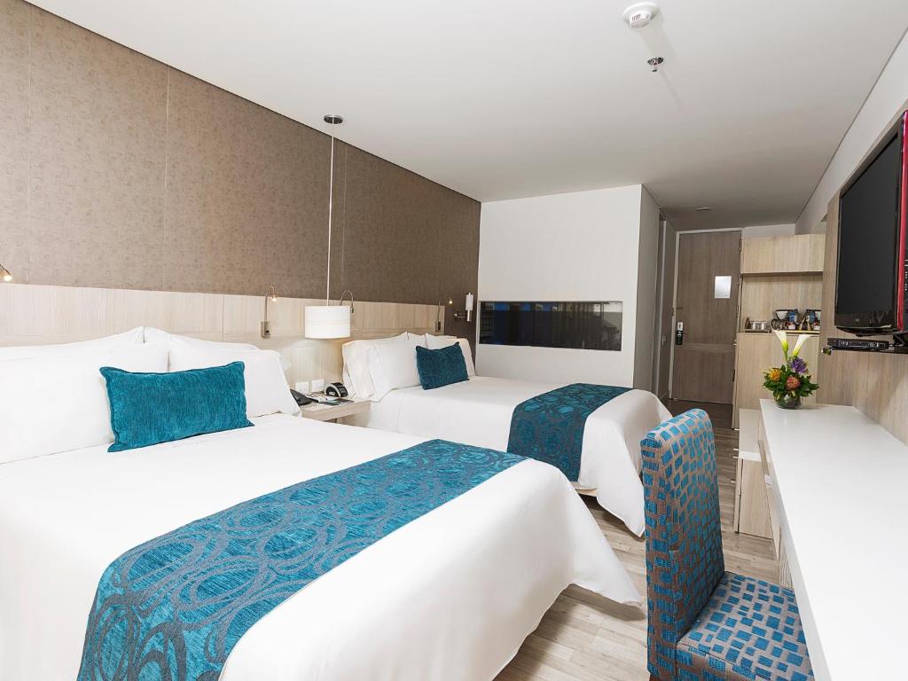 Postel nebo postele na pokoji v ubytování Hotel bh Bicentenario