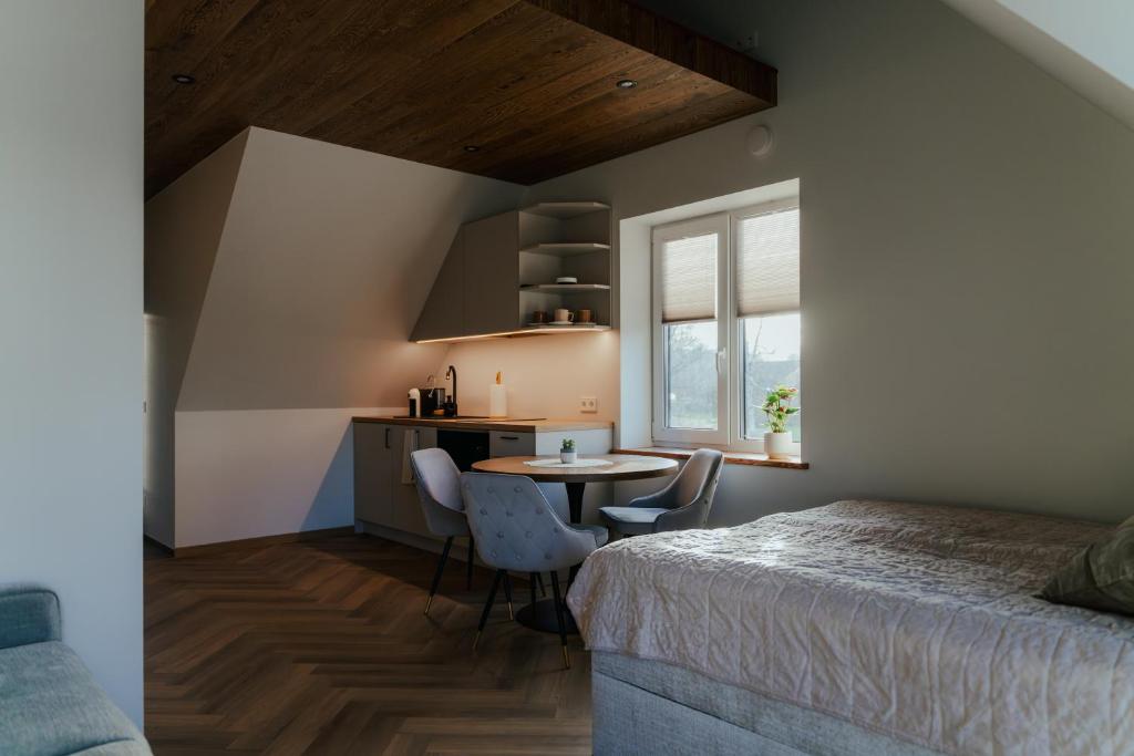 Postel nebo postele na pokoji v ubytování Good Home Apartment