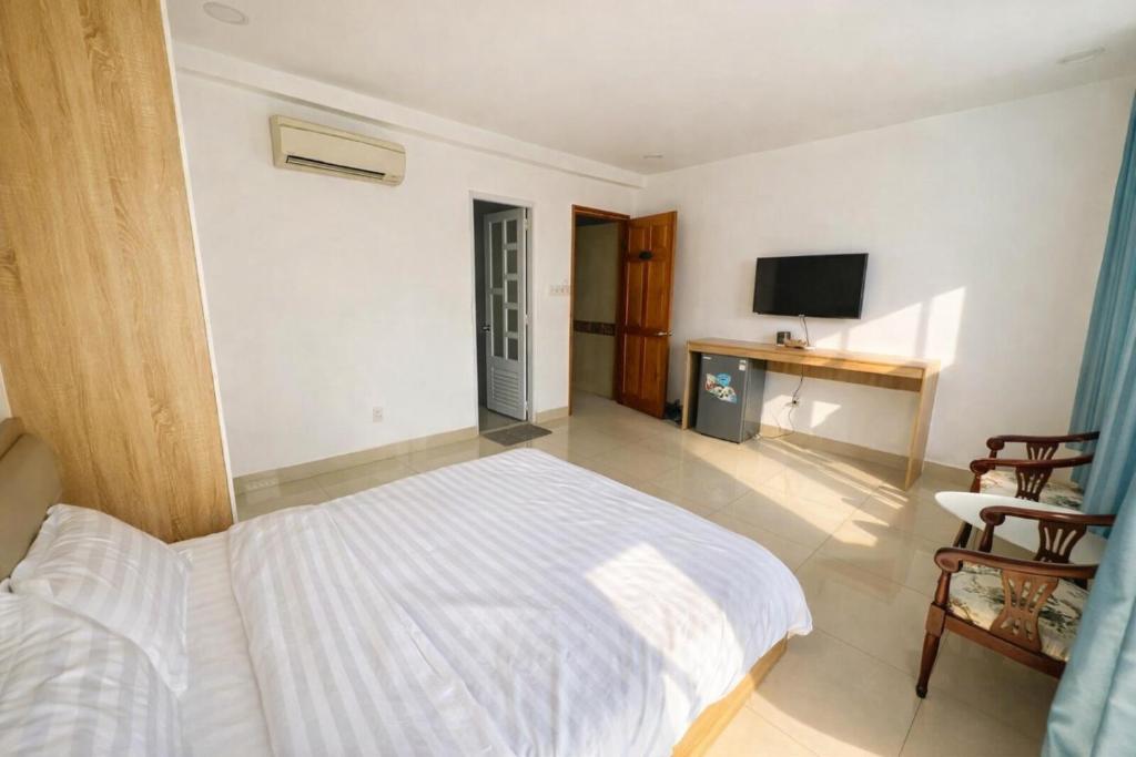 Postel nebo postele na pokoji v ubytování Hoàng Lâm Hotel