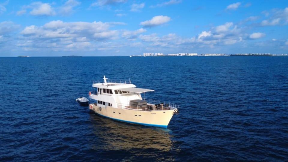 a white boat in the middle of the water at Ocean Pearl in Filitheyo