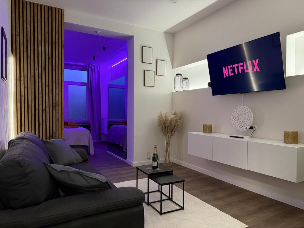 Et tv og/eller underholdning på Suite Luxueuse avec jaccuzi sans vis-à-vis