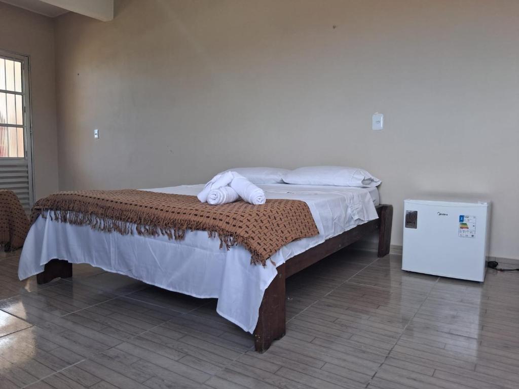 En eller flere senge i et værelse på Pousada barra golden