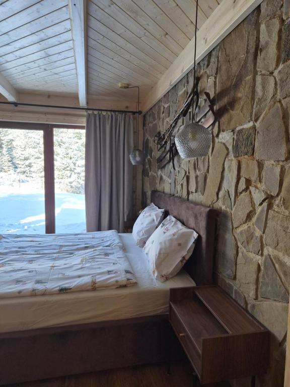 En eller flere senge i et værelse på Chata u Wozniaka