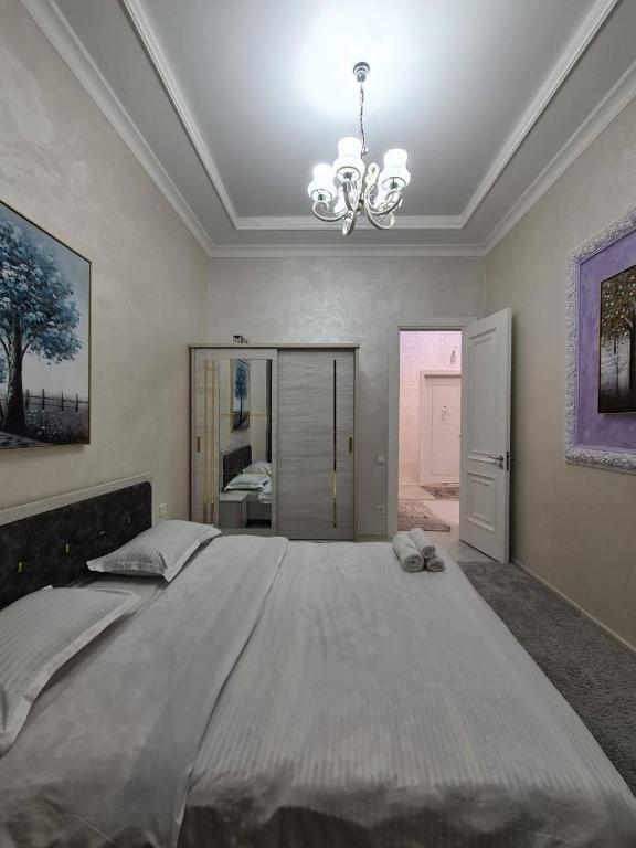 En eller flere senge i et værelse på Toshkent siti