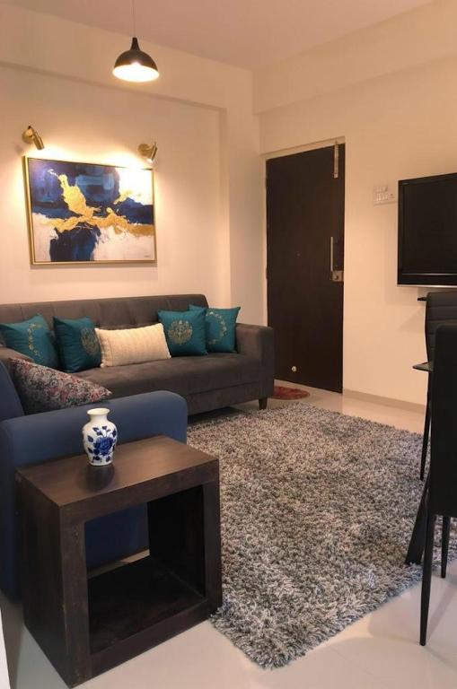 a living room with a couch and a table at Goa stays in Anjuna