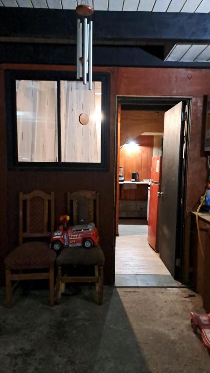 a living room with a table with a toy car on it at Departamento interior, con estacionamiento in Panguipulli