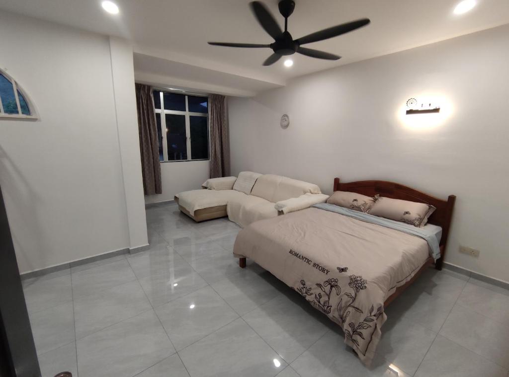 En eller flere senge i et værelse på Sweet Home