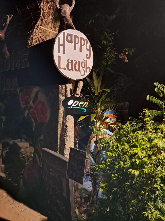 a sign that says happy laugh on the side of a building at Happy Laugh Ella in Ella