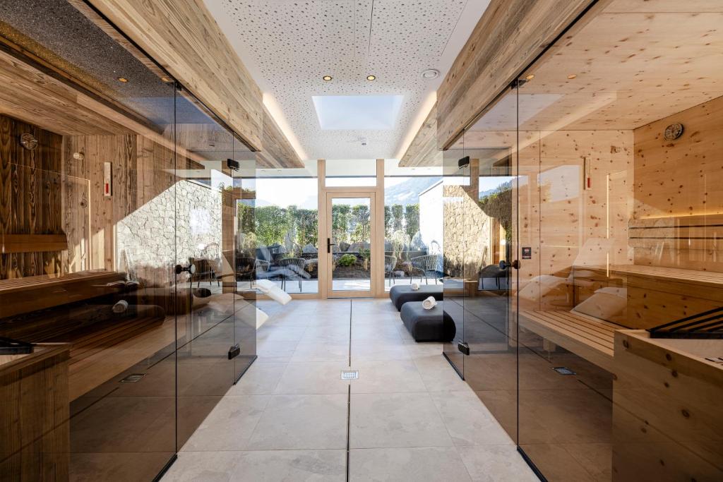a large room with glass walls and a living room at my Zillernest in Zell am Ziller