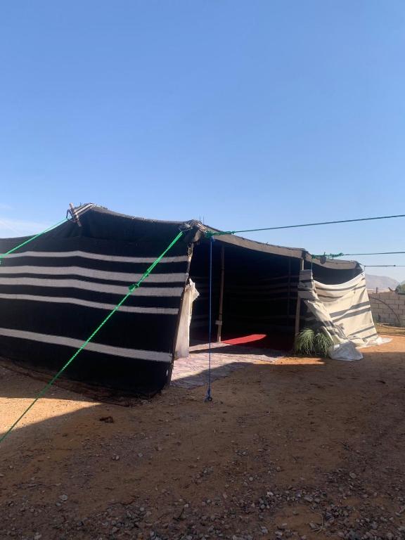 a black and white boat sitting in the dirt at Bedouin experiences in Aqaba
