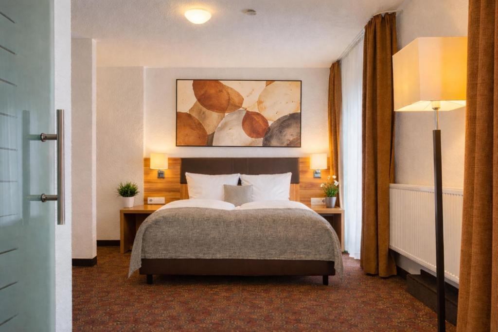 En eller flere senge i et værelse på Sautter Hotel Stuttgart City