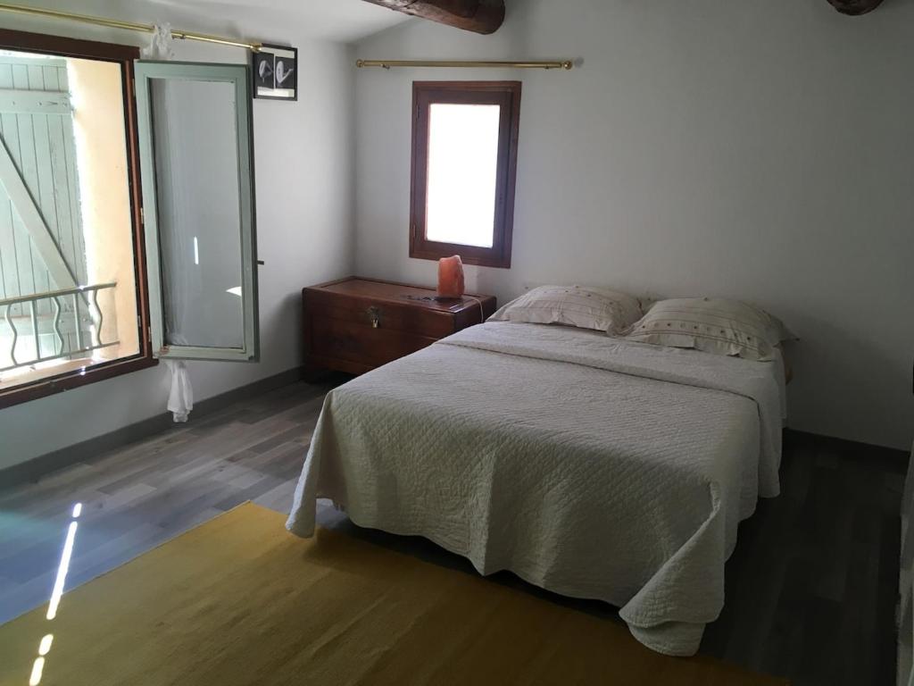 En eller flere senge i et værelse på Charmant bastidon Provençal
