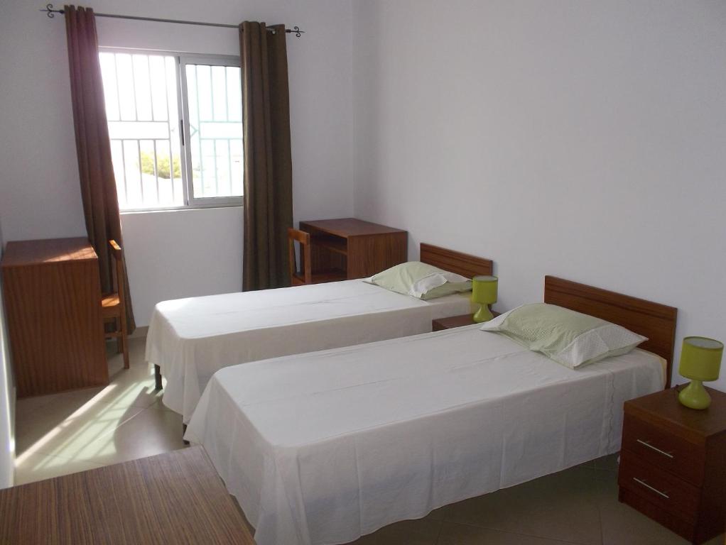 Postel nebo postele na pokoji v ubytování Basic Hotel