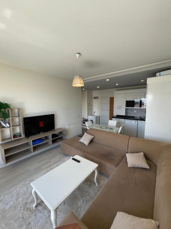 a living room with a couch and a table at Flat in Samsun atakum in Atakum