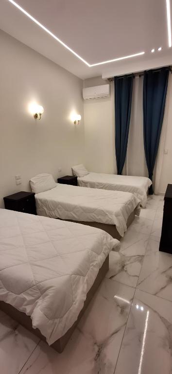 Postel nebo postele na pokoji v ubytování Cairo Villa Hotel