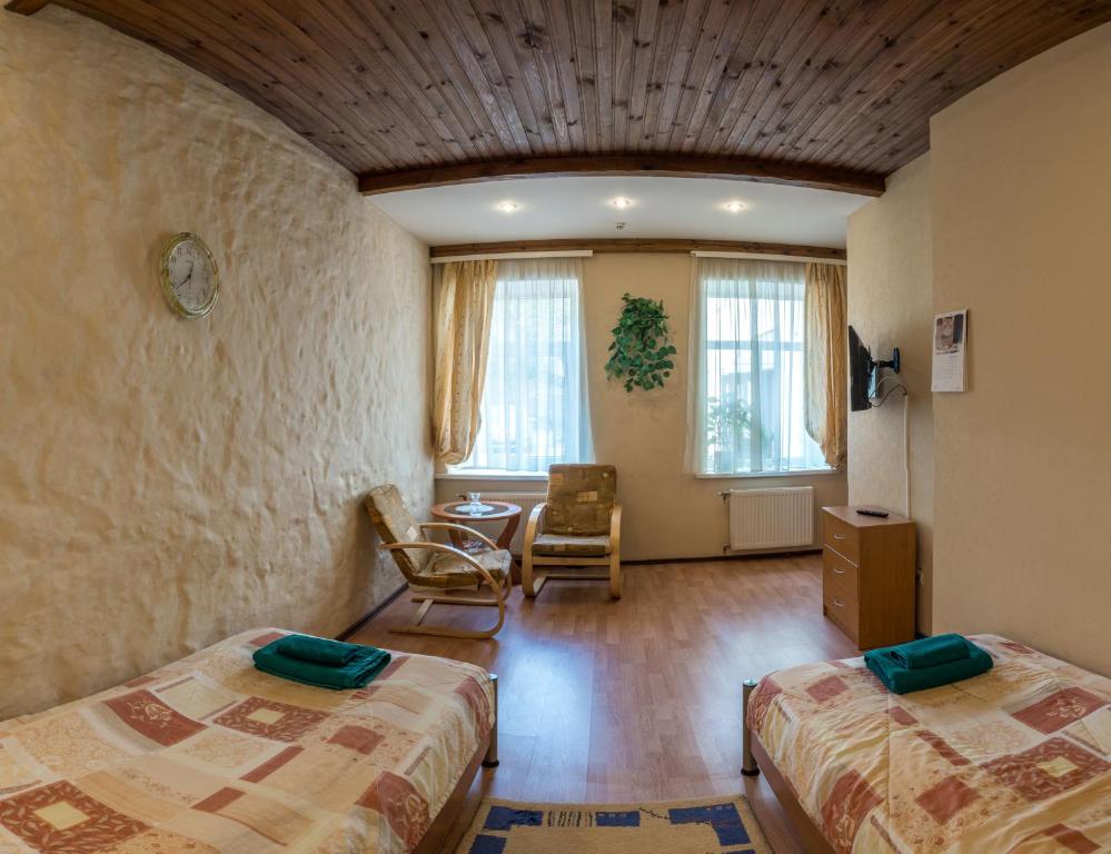 Postel nebo postele na pokoji v ubytování Leo