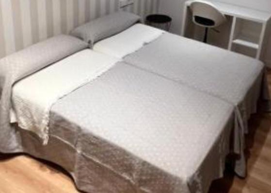 En eller flere senge i et værelse på Apartamento Xogo da Ola En el camino De Santiago