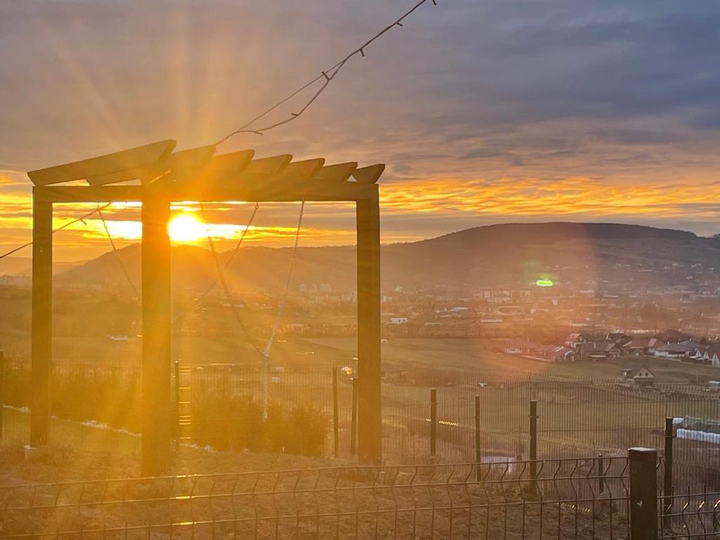 a view of the sunset from the top of a mountain at Sunset Hills Transylvania in Odorheiu Secuiesc