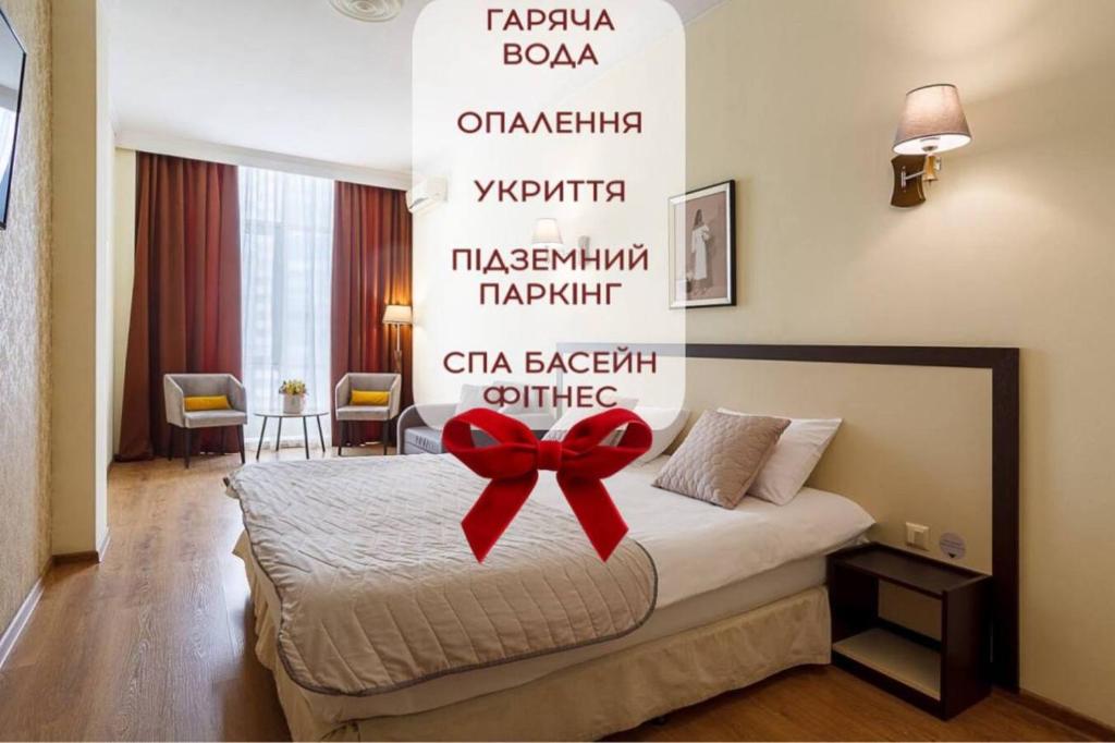 En eller flere senge i et værelse på Corona Hotel & Apartments