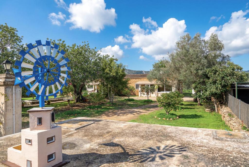 a large blue clock on top of a house at Es Marroig Villa y Spa in Llucmajor