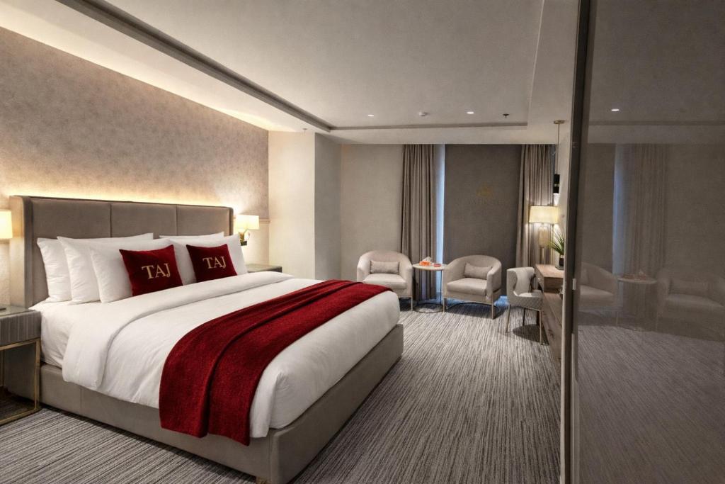 Postel nebo postele na pokoji v ubytování Taj Executive Boutique Hotel - Central F-7 Islamabad